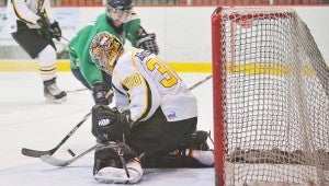 Austin Bruins goalie Keegan Asmundson stops a shot by Alexandria's Tucker Coborn. Herald File Photo