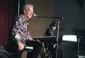 Ray Manzarek answers a question from the audience during his show with Roy Rogers Saturday night at the Paramount Theatre. - Eric Johnson/photodesk@austindailyherald.com