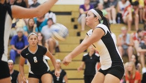 Blooming Prairie's Nicole Inwards handles a serve during game two of their match against Austin in Packer Gym. -- Herald File Photo