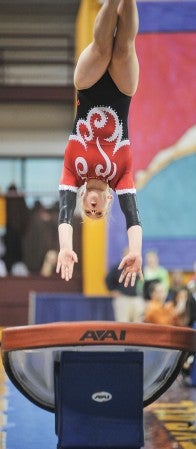 Austin's Sela Fadness comes off the vault during the Class A Minnesota State Gymnastics Meet individuals Saturday at the University of Minnesota's Sports Pavilion. Fadness finished second in vault.