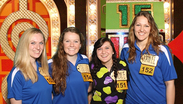 Nicole Jax of Waltham, second from right, celebrates on Jan. 8 with her friends, from left, Rachel Toren, Maggie Stiles and Kaylee Wegner on the set of The Price is Right. Jax won $41,478 in prizes, including a trip to Los Angeles and a Dodge Charger. The episode aired Tuesday. -- Photo submitted