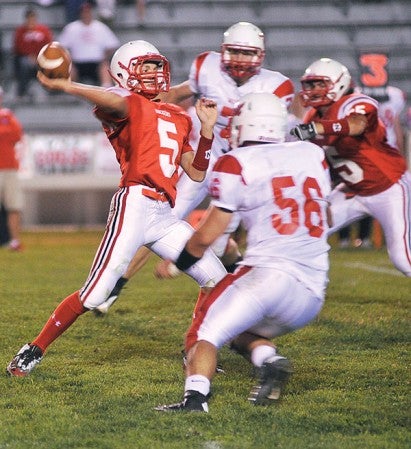 Austin's Ryan Synoground steps up in the pocket to throw during the second quarter Friday night against Mankato West at Art Hass Stadium.