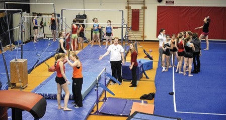 The Packer gymnastics team practices with  the YMCA youth gymnastics program at the Y.