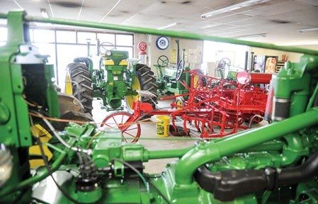 The showroom at Lee J. Sackett, Inc. in Waltham is stuffed full of tractors Lee and his staff have restored over the year.