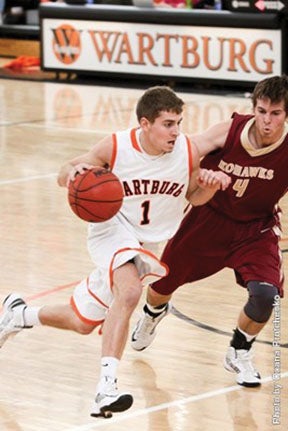 Hayfield grad Tanner Kramer handles the ball against Coe College this past season. Kramer is a back-up point guard for the Knights, but he missed the conference tournament with a serious illness