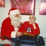 Edith Morey gets a visit from Santa in December 2004.