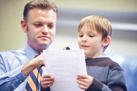 Sumner Elementary student Jackson Goetz reads his poem during recognition of finalists in The Richard Eberhart Poetry Contest Thursday night at the Austin Public Library.