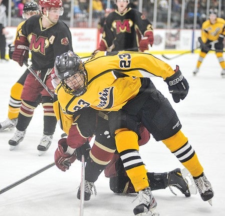 Ladislov Zikmund fights through traffic on the way to the puck in the second period against Minot Saturday night during game two of their playoff series at Riverside Arena.