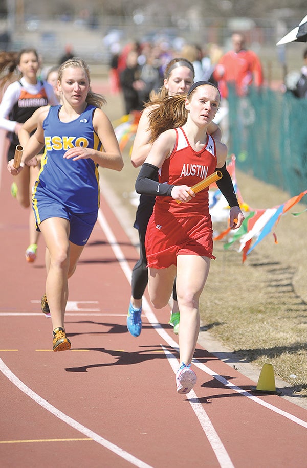 Austin’s Haley Splinter leads after one lap Saturday in the 4x800 relay during the Austin Invitational at Larry Gilbertson Track. Eric Johnson/photodesk@austindailyherald.com