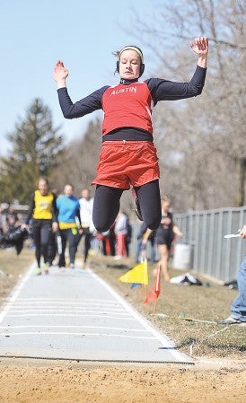 Austin's Meridith Fritz gets in the air during one of her attempts in the triple jump Saturday during the Austin Invite.