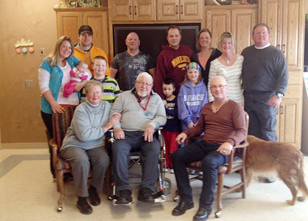 George Moline, front row center, gathers with family on his 84th birthday celebration.