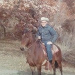 George Moline, 38 at the time, takes his horse trail riding.