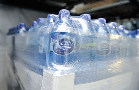 Artesian Fresh bottled water is packaged and ready to be shipped from the business warehouse east of LeRoy on Highway 56.