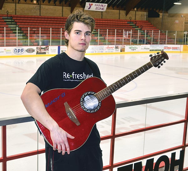 John Simonson of the Bruins is more than just hockey. The forward can also carry a tune with his guitar playing.