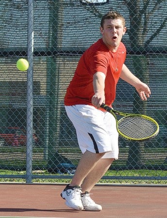 Austin's Pat Wagner returns a serve during the No. 1 singles match against Winona Friday afternoon at Paulson Courts. -- Eric Johnson/photodesk@austindailyherald.com