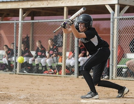 Blooming Prairie's Madison Worke lays down a bunt against Kenyon-Wanamingo in the second inning of the Section 1A West Division championship Friday evening at Todd Park.