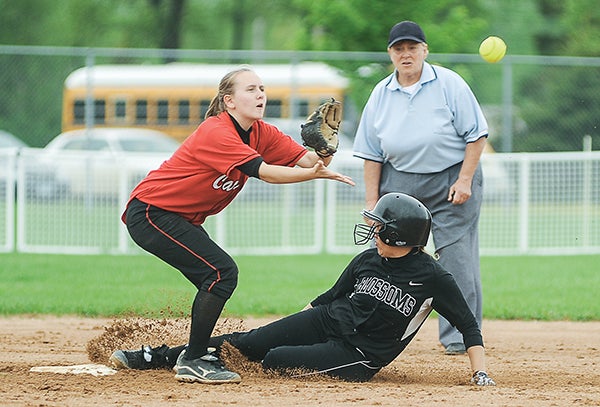 Blooming Prairie's Jenna Krell steals second as Lewiston-Altura's Sarah Meilner waits for the ball during their semifinal game in the Section 1A tournament Tuesday night at Todd Park. Eric Johnson/photodesk@austindailyherald.com