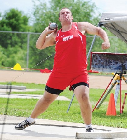 Andrew Hagen, a junior thrower from Austin, prepares to hurl the shot put Thursday at the Section 1AA track and field meet at Lakeville South High School. — Micah Bader/Albert Lea Tribune.