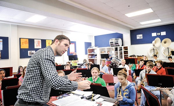 Austin music director Brad Mariska directs the concert band Tuesday morning as they rehearse music from "Phantom of th Opera" in preparation for the May 14th Big Band Blast. Eric Johnson/photodesk@austindailyherald.com