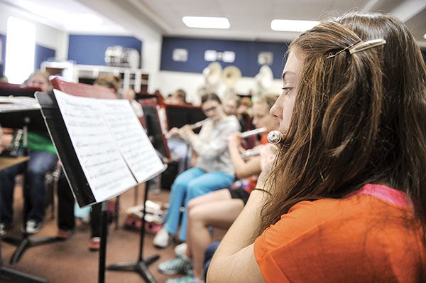 Bailee Brooks, playing the flute, rehearses with the rest of the concert band Tuesday morning as the group prepares for the  upcoming Big Band Blast on May 14.  Eric Johnson/photodesk@austindailyherald.com
