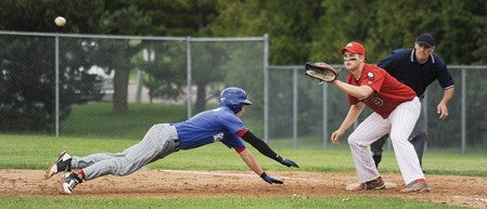 Southland's Decker Bendtsen dives back into first on a pick-off attempt as Wabasha-Kellogg first baseman Bryce Breuer waits for the throw in the fourth inning of the Section 1A finals Wednesday night.
