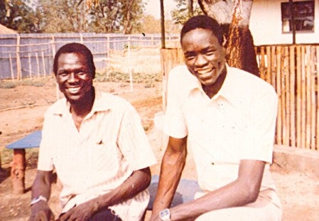 Didumo's father, Agwa Alemo, left, sits with his friend and colleague, Okok Ojulu, about 30 years ago in Ethiopia. Ojulu had to leave Ethiopia to live in Kenya, in exile.