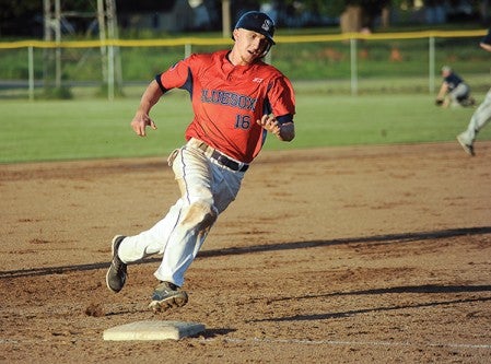 The Austin Blue Sox Jamie Adams rounds third to score in the first inning against Blue Earth Tuesday night at Marcusen Park.