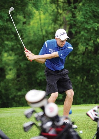 Trevor Anderson, a senior from of Hayfield, keeps his eyes on the ball as he prepares to swing Tuesday at Pebble Creek Golf Course in the Class A state golf tournament. -- Micah Bader/Albert Lea Tribune    