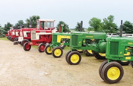Despite morning rain, people showed up in droves to this year's Breakfast on the Farm at Jim and Connie Sathre's farm. Sights included farm machinery, antiques, animals, games and more.