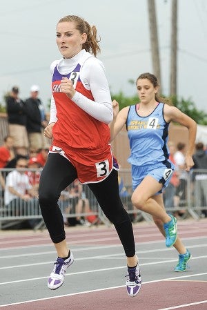 Grand Meadow-LeRoy-Ostrander-Southland's Elizabeth May heads down the backstretch of the the second heart in the 400-meter dash during the Class A Minnesota State Track Meet Friday at Hamline University in St. Paul.