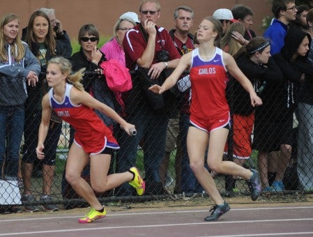 GMLOS's Danielle Hanson takes off after getting the hand-off from teammate Sydney Bendtsen in the 4 x 400-meter relay in the Class 'A' state track and field meet in St. Paul Saturday. -- Rocky Hulne/sports@austindailyherald.com