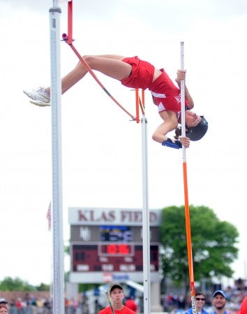 Austin's Abby Snater clears the pole vault bar at 11 feet at the Class 'AA' state track and field meet in St. Paul Saturday. Snater finished tied for eighth. -- Rocky Hulne/sports@austindailyherald.com