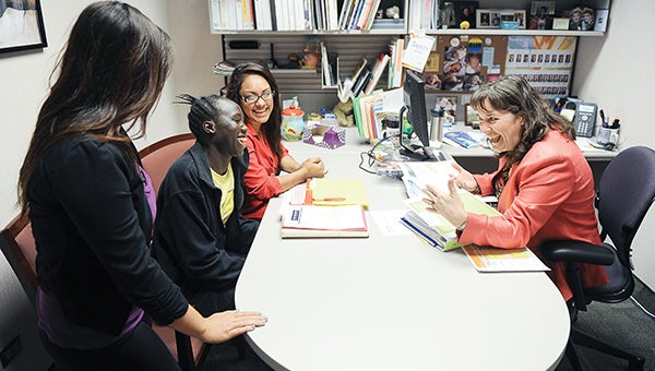 Laura Brock, Hormel Foods corporate manager of diversity and inclusion, jokes with interns Emily Johannsen, from left, Ochudo Cham and Nancy Rodriguez about their presentations they will have to give at the end of their internships with Hormel.