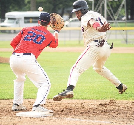 The Greyhounds' Jeremy Williams jumps back to the bag as Blue Sox first baseman Brady Klingfus waits of the ball on a pick-off attempt Saturday at Marcusen Park.