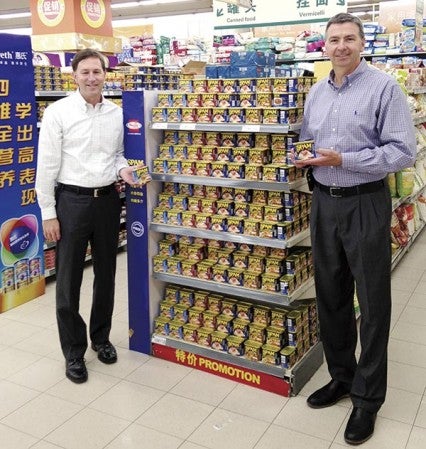 Jim Snee, president of Hormel Foods International Corp., and Hormel CEO Jeff Ettinger with a display of Spam in a Chinese store. Photos provided