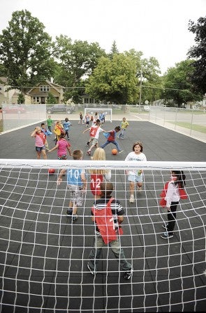 Sumner Elementary students play a pick-up game of soccer during Thursday’s recess on the school’s new play area. The area replaces playground equipment that once stood in that part of the school.  Eric Johnson/photodesk@austindailyherald.com