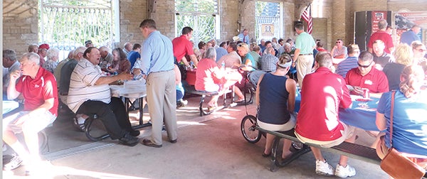 Candidates taking part in the Lincoln-Reagen Picnic visit locals during the third annual event at the Veterans Pavilion.