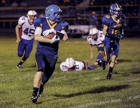 Hayfield's Cole Kruger on a carry against Southland in the third quarter Friday night in Hayfield. Eric Johnson/photodesk@austindailyherald.com