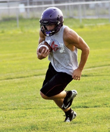 Grand Meadow's Landon Jacobson carries the ball in practice in Grand Meadow Monday. -- Rocky Hulne/sports@austindailyherald.com
