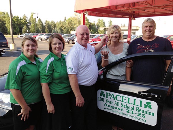 From left, Pacelli Catholic Schools Assistant Principal Laura Marreel, Pacelli Principal Mary Holtorf and Pacelli President Jim Hamburge presented the keys of the 2013 Dodge Avenger to Fran and Diane Baudoin of Dexter. Photo provided