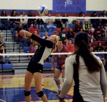 Blooming Prarie's Madison Worke makes a dig against Southland in Adams Saturday. -- Herald File Photo