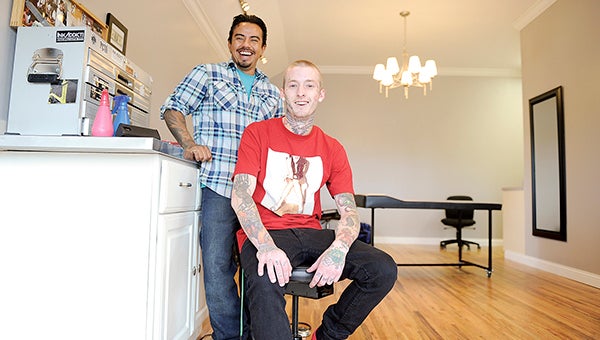 Alex Wheelock, owner of Alex's Tattoo on Broadway, and tattoo artist Amado Cortes have opened up shop in Mapleview. The duo will also be joined by Angie Pipkorn. Eric Johnson/photodesk@austindailyherald.com