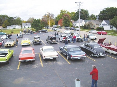 People check out the cars at the legion's car show Sunday. Photo provided