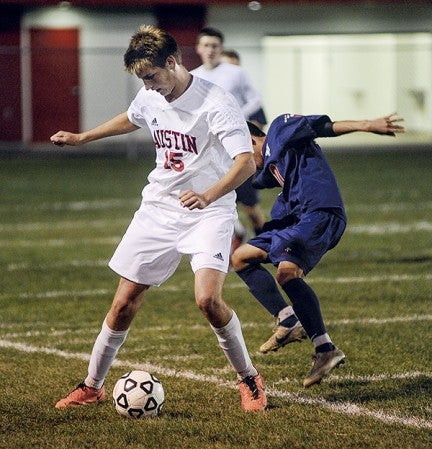 Austin's Noah Brrehmer settles the ball after a take away in the second half of the Packers Section 2A Section Tournament game against Albert Lea at Art Hass Stadium Thursday night. Eric Johnson/photodesk@austindailyherald.com