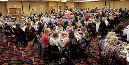Women of Austin went to the old west for the annual Ladies Night Out Thursday night at the Holiday Inn Convention Center Thursday night. Eric Johnson/photodesk@austindailyherald.com