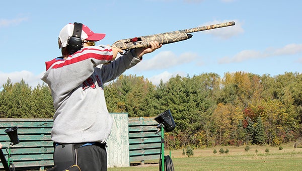 Seth Gerber, second in points on the AHS trapshooting team and ninth in the state, fires at a clay target in the 16-yeard trapshoot.