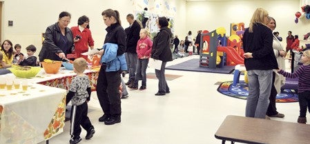 Hundreds of residents toured the new Apple Lane Child Care Center, including its expansive play area.