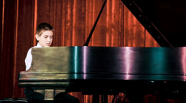 Runner-up in the junior division Isaac Kubas played during the final round of judging last year during the first Harris Piano Competition at the Paramount Theatre. Herald file photo