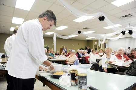 The Cedars of Austin executive chef Jack Irwin begins preparations for his dishes during a cooking show in October at the Mower County Senior Center. Herald file photo