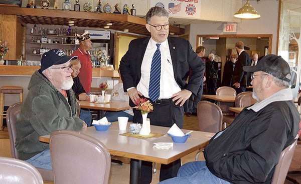 U.S. Sen. Al Franken, D-Minn., speaks with veterans at the Austin American Legion Monday. Franken toured the region this Veterans Day to promote increased access to health care for rural veterans. Trey Mewes/trey.mewes@austindailyherald.com